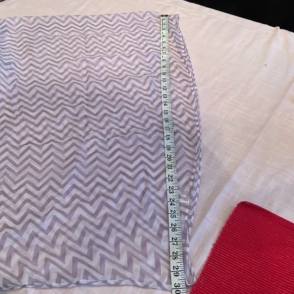 NWOT lavender and white infinity scarf. Adds flair to any outfit